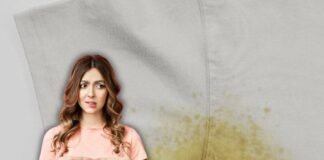 donna indecisa e maglietta macchiata di sudore