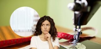 donna che pensa a come accorciare le tende lunghe
