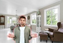 uomo dubbioso e soggiorno alle sue spalle