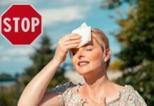 Addio al caldo torrido, gli italiani tornano a respirare: segnatevi questa data donna che si asciuga sudore per il caldo e segnale stop