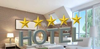 camera da letto e scritta hotel con 5 stelle
