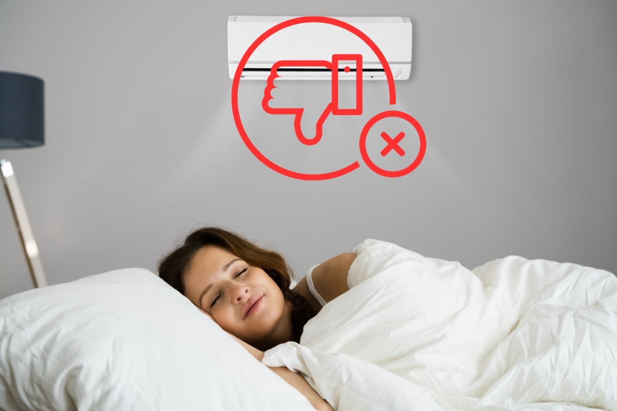 donna che dorme sotto al condizionatore e pollice in giù