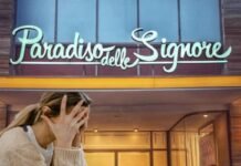 Insegna il paradiso delle signore e donna triste