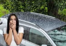 grandine su auto e donna spaventata