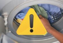 lavatrice e segnale di pericolo