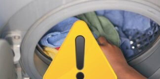 lavatrice e segnale di pericolo