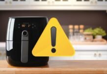 friggitrice ad aria e segnale giallo di pericolo