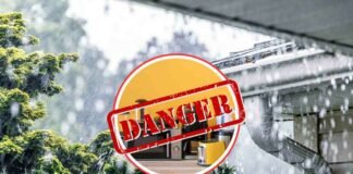 pioggia, elettrodomestici e segnale di pericolo