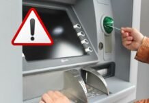 Attenzione! Non prelevare al bancomat quando sei in vacanza: cosa rischi mano che inserisce carta nell'ATM e segnale pericolo