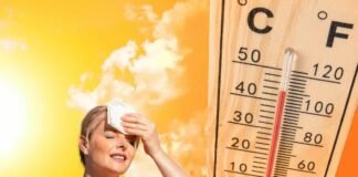 termometro e donna che ha caldo