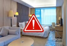 Il rischio (quasi) invisibile che si nasconde nelle camere di hotel: cosa fare per non correre pericolo camera d'hotel e segnale di pericolo