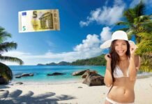 Ha la spiaggia più bella d’Europa e offre street food a 5 euro: prenota subito! spiaggia paradisiaca, donna con cappello 5 euro