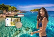 spiaggia Ksamil, donna felice, 7 euro