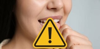 segnale di pericolo su donna che sta rosicchiando un unghia