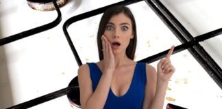 donna stupita e griglie del piano cottura