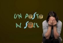 un posto al sole logo e donna triste