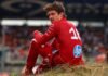 Nuovo team per Leclerc, c’è l’annuncio: si chiude l’era in Ferrari Charles Leclerc seduto su una collina